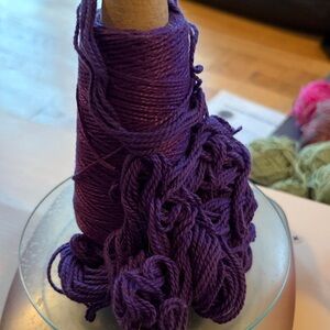 100% mercerized cotton, dark purple yarn on cone 3.5 ounces